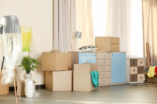 Furniture removal team collecting bulky items in a Knightsbridge home