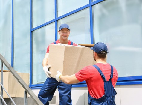 Packed moving boxes and furniture prepared for removal truck hire in Knightsbridge
