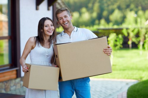 Relocation team handling office equipment and documents in Knightsbridge
