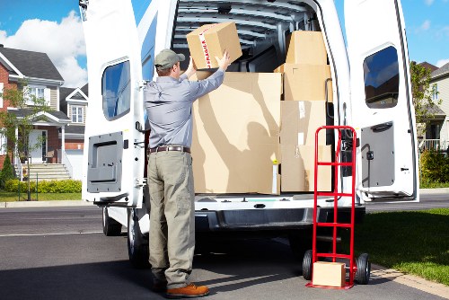 Professional moving team handling boxes in a Knightsbridge apartment building