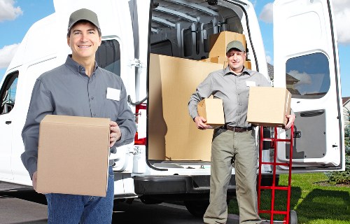 Local removalists handling furniture and boxes in a Knightsbridge residential street
