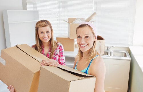 Helper and van transporting boxes in central London